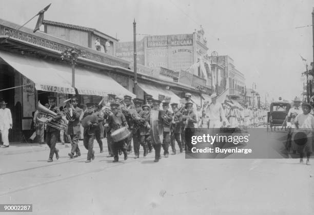 Mexican Band Plays Instruments in front of Marching Columns of US Navy Sailors ashore as a result of the Tampico Affair