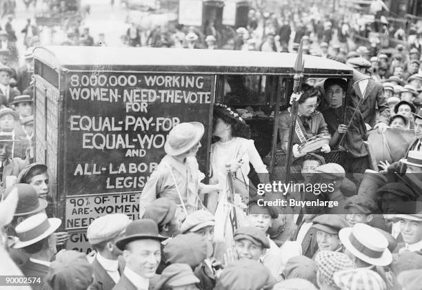 On the Top of a double Decker Bus, Washington Suffragettes make their Cause known astride a city trolley