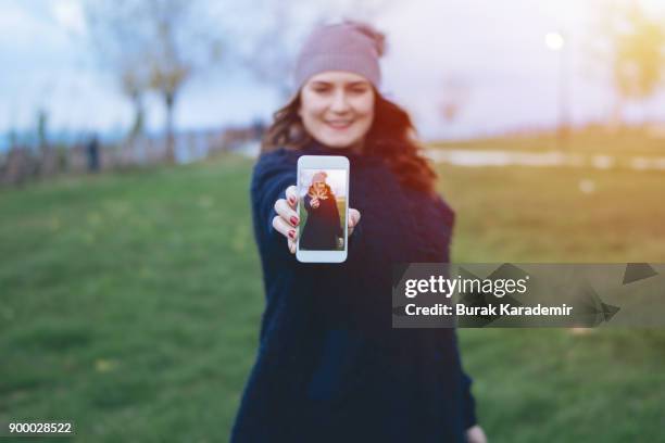 winter breaks - winter woman showing stock pictures, royalty-free photos & images