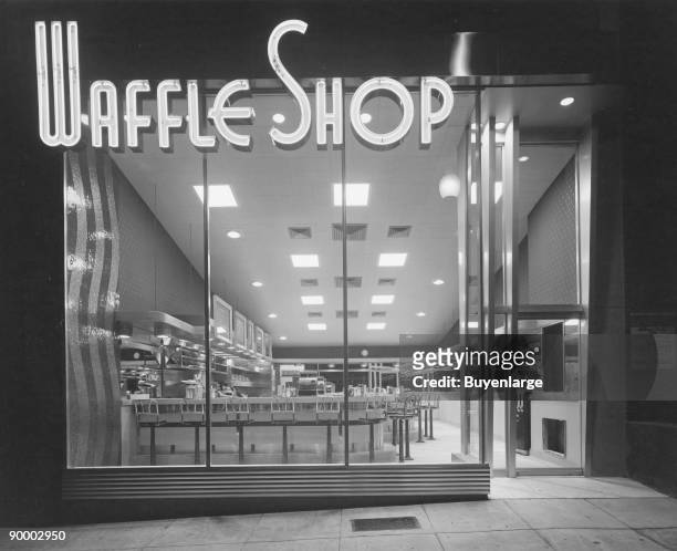 It must be a Congressional Break as the exterior of the Art Deco Waffle Shop is deserted. Retail window of the restaurant.Neon Sign Lights...