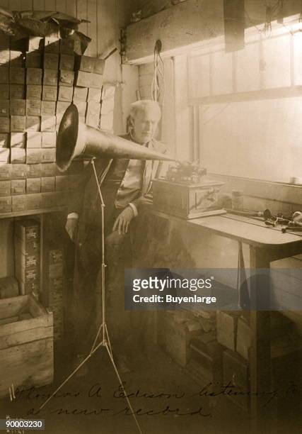 American inventor and businessman Thomas Edison listening to an Edison Standard Phonograph, at his lab in West Orange, New Jersey, 1906. The Edison...