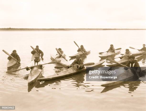 Eskimos in kayaks, Noatak, Alaska