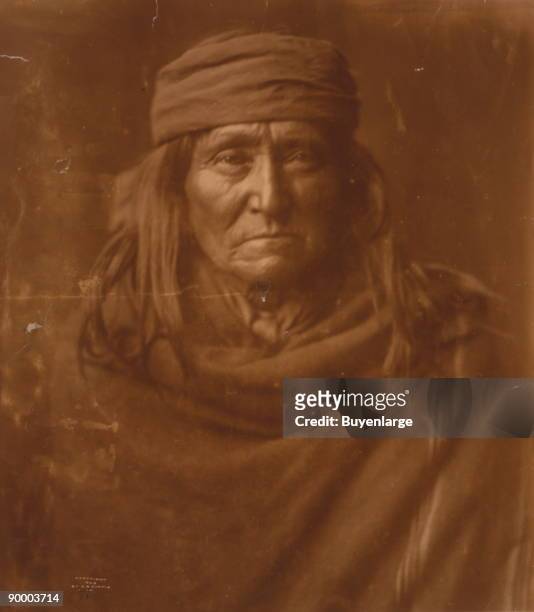 Apache Indian, head-and-shoulders portrait, facing front.