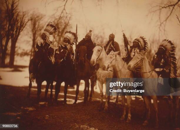 Six tribal leaders Little Plume , Buckskin Charley , Geronimo , Quanah Parker , Hollow Horn Bear , and American Horse on horseback in ceremonial...