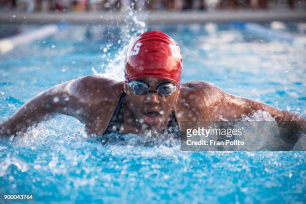 female swimmer at a swim meet. - swimming cap stock pictures, royalty-free photos & images