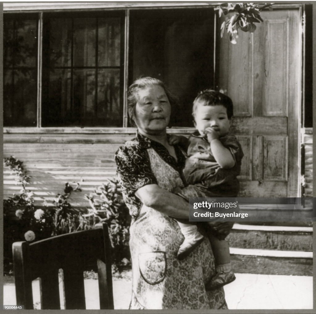 Grandmother Hold Baby in evacuation to Manzanar