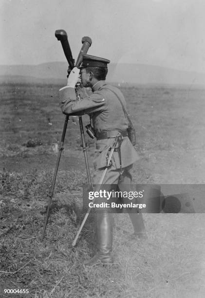 Prince Regent Hirohito looks through Army Field Periscope