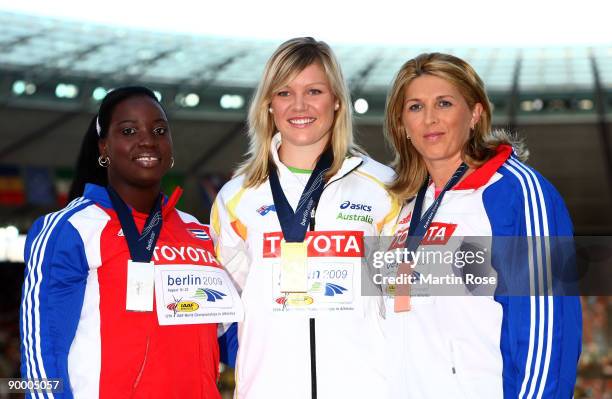 Yarelis Barrios of Cuba receives the silver medal, Dani Samuels of Australia the gold medal and Nicoleta Grasu of Romania the bronze medal during the...