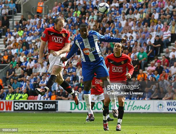 Wayne Rooney of Manchester United scores the opening goal during the Barclays Premier League match between Wigan Athletic and Manchester United at...
