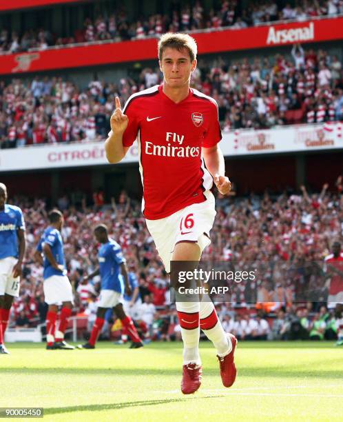 Arsenal's Welsh player Aaron Ramsey celebrates scoring Arsenal's fourth goal during the Premier League football match between Arsenal and Portsmouth...