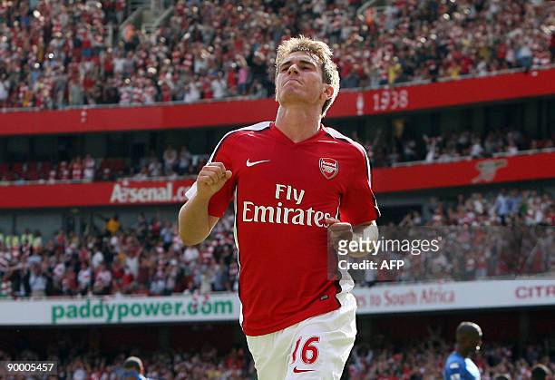 Arsenal's Welsh player Aaron Ramsey celebrates scoring Arsenal's fourth goal during the Premier League football match between Arsenal and Portsmouth...