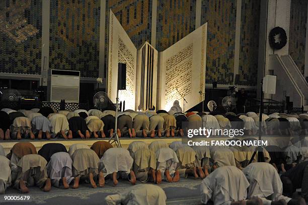 Pakistani Muslims offer special 'Taraweh' prayers on the first day of the holy month of Ramadan at the giant Faisal Mosque in Islamabad on August 22,...