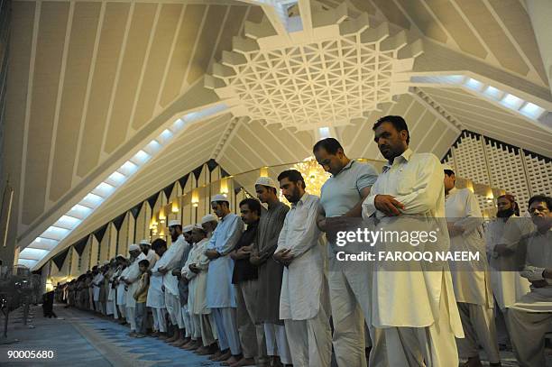 Pakistani Muslims offer special 'Taraweh' prayers on the first day of the holy month of Ramadan in Karachi on August 22, 2009. Muslims entered the...