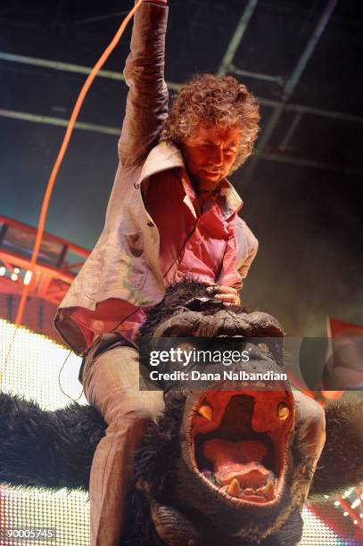 Wayne Coyne of the Flaming Lips with a gorilla at the Marymoor Amphitheater on August 21, 2009 in Redmond, Washington.