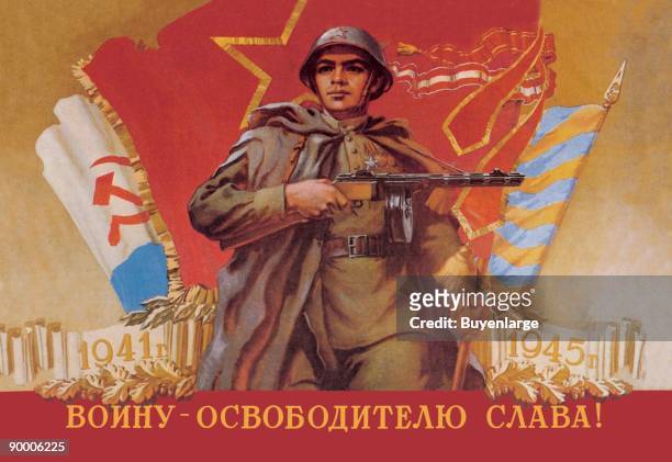 Russian Soldiers have Liberated the Country from the Nazi and a Soldiier with Macihine Gun stands bravely infront of Russian Flags.