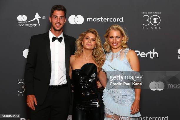 Natalie Bassingthwaighte of the Rogue Traders poses with Thanasi Kokkinakis and Daria Gavrilova of Australia at the 2018 Hopman Cup New Years Eve...
