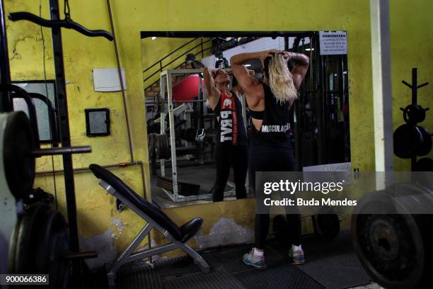 Brazilian UFC flyweight fighter Priscila "Pedrita" Cachoeira trains at gym on December 29, 2017 in Rio de Janeiro, Brazil. The trajectory of the...