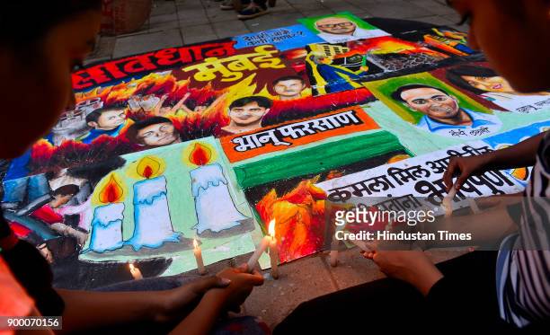 Students of Gurukul Art of school, Lalbaug painted a drawing and paid tribute people who died in fire at Kamla Mill compound on December 30, 2017 in...