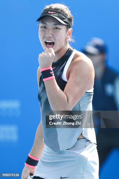 Xinyu Wang of China celebrates a shot during the match against Danka Kovinic of Montenegro during Day 1 of 2018 WTA Shenzhen Open at Longgang...