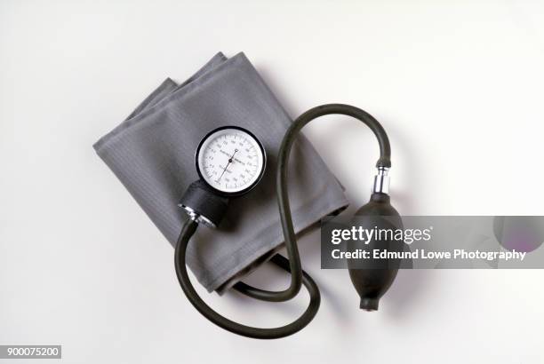 blood pressure cuff on white background. - medical device foto e immagini stock