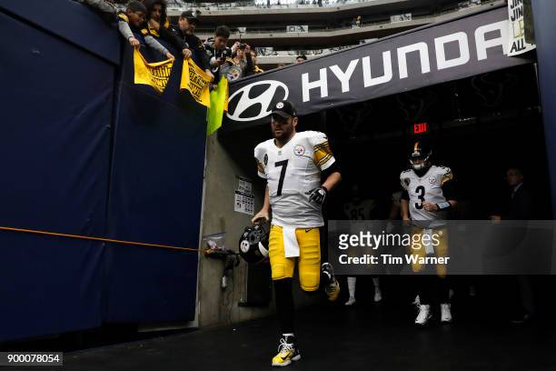 Ben Roethlisberger of the Pittsburgh Steelers and Landry Jones run out of the tunnel before the game against the Houston Texans at NRG Stadium on...