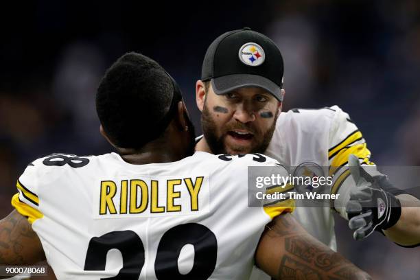 Ben Roethlisberger of the Pittsburgh Steelers greets Stevan Ridley before the game against the Houston Texans at NRG Stadium on December 25, 2017 in...