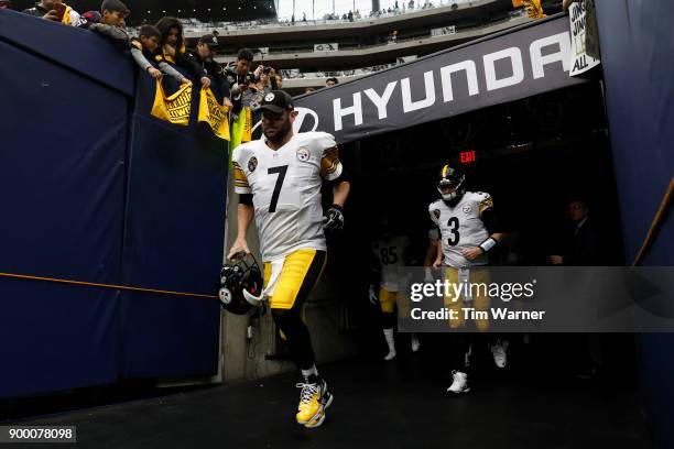 Ben Roethlisberger of the Pittsburgh Steelers and Landry Jones run out of the tunnel before the game against the Houston Texans at NRG Stadium on...