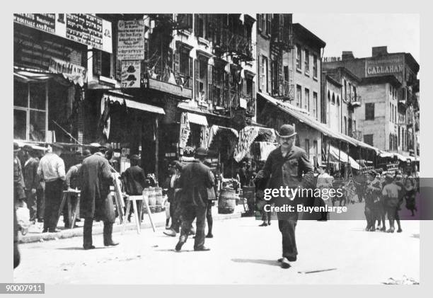 Street Level View of People Walking on Hester Street