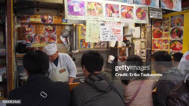 sushi stand at tsukiji outer market - tsukiji outer market stock pictures, royalty-free photos & images