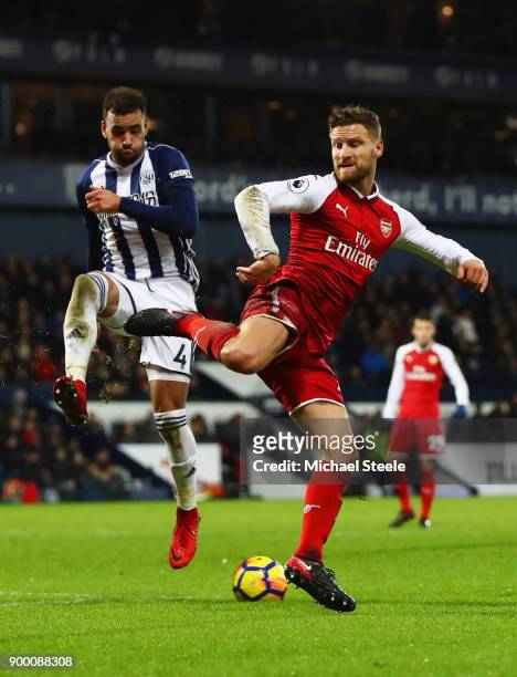 Hal Robson-Kanu of West Bromwich Albion and Shkodran Mustafi of Arsenal battle for the ball during the Premier League match between West Bromwich...