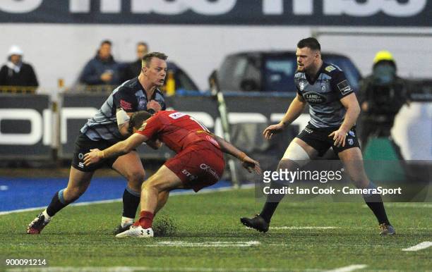 Cardiff Blues' Matthew Rees smashes into Scarlets' Paul Asquith during the Guinness Pro14 Round 12 match between Cardiff Blues and Scarlets at...