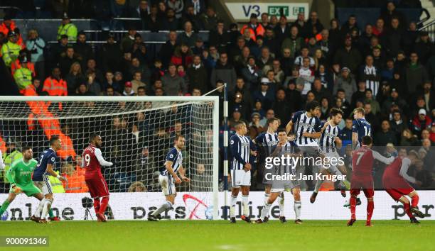 Alexis Sanchez of Arsenal scores their first goal from a free kick during the Premier League match between West Bromwich Albion and Arsenal at The...