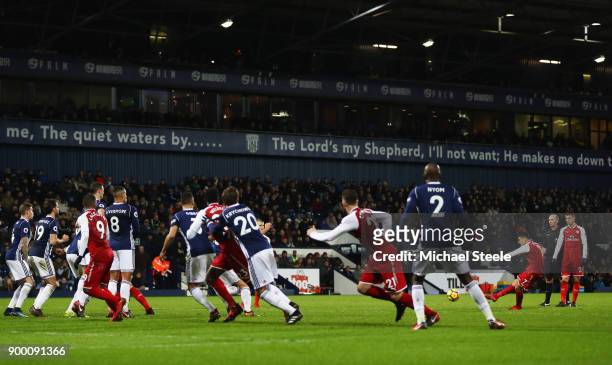 Alexis Sanchez of Arsenal scores their first goal from a free kick during the Premier League match between West Bromwich Albion and Arsenal at The...
