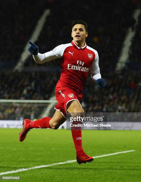 Alexis Sanchez of Arsenal celebrates as his free kick deflects off James McClean of West Bromwich Albion for their first goal during the Premier...