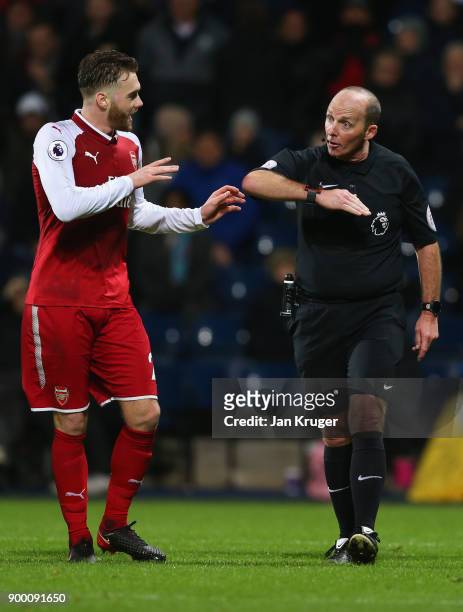 Calum Chambers of Arsenal appeals as referee Mike Dean awards a penalty against him during the Premier League match between West Bromwich Albion and...