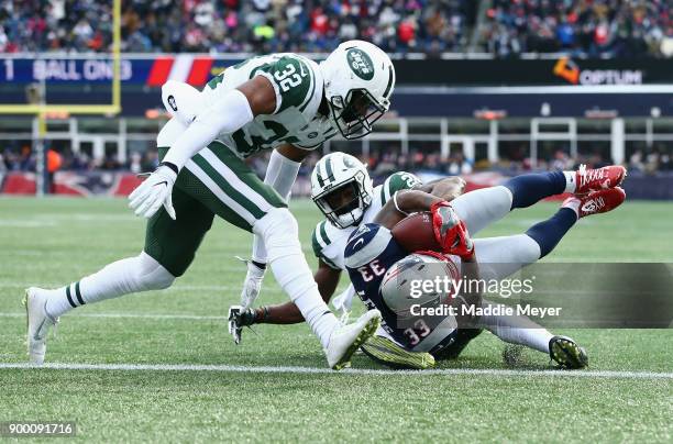 Dion Lewis of the New England Patriots rushes for a 3-yard touchdown during the first quarter against the New York Jets at Gillette Stadium on...