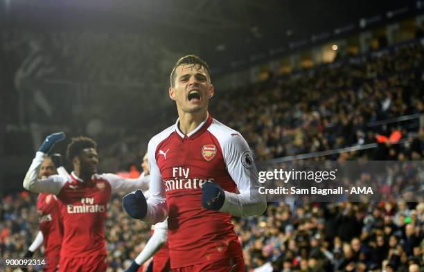 Alexis Sanchez of Arsenal celebrates after scoring a goal to make it 0-1 during the Premier League match between West Bromwich Albion and Arsenal at...