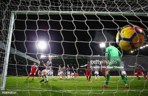 Ben Foster of West Bromwich Albion fails to stop a free kick by Alexis Sanchez of Arsenal which deflects off James McClean of West Bromwich Albion...