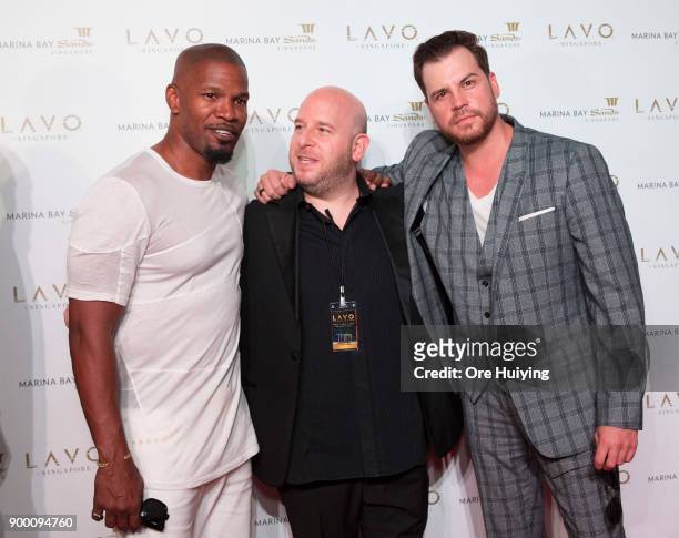 Actor Jamie Foxx, Tao Group Partner Noah Tepperberg, and Dave Osokow attend the LAVO Singapore Grand Opening at Marina Bay Sands on December 31, 2017...