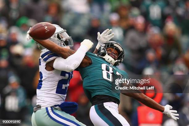 Wide receiver Torrey Smith of the Philadelphia Eagles attempts a catch against strong safety Xavier Woods of the Dallas Cowboys during the first...