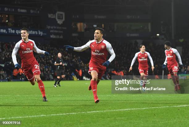 Alexis Sanchez celebrates scoring Arsenal's goal during the Premier League match between West Bromwich Albion and Arsenal at The Hawthorns on...