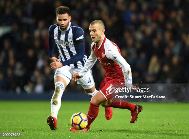 Jack Wilshere of Arsenal takes on Hal Robson Kanu of WBA during the Premier League match between West Bromwich Albion and Arsenal at The Hawthorns on...