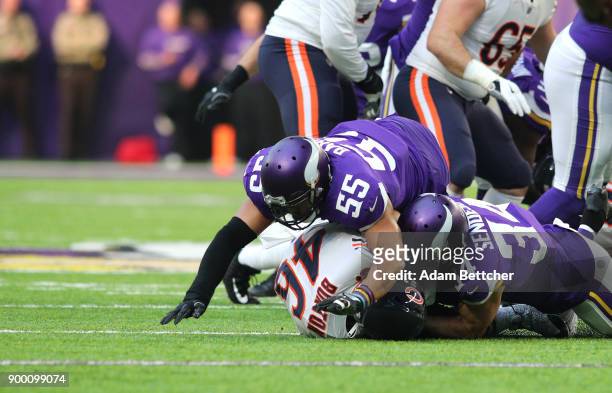 Anthony Barr and Andrew Sendejo of the Minnesota Vikings tackle Michael Burton of the Chicago Bears for no gain on third down in the first quarter of...