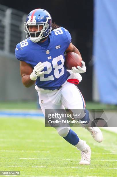 Paul Perkins of the New York Giants runs with the ball during the first half of their game against the Washington Redskins at MetLife Stadium on...