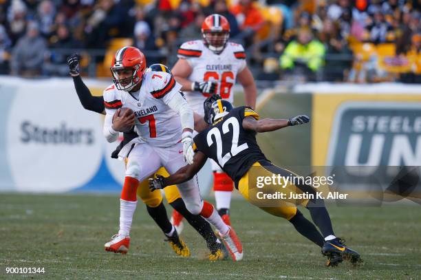 DeShone Kizer of the Cleveland Browns runs up field against William Gay of the Pittsburgh Steelers in the second quarter during the game at Heinz...