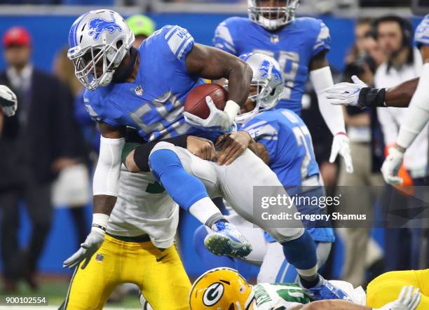 Tahir Whitehead of the Detroit Lions recovers a fumbler by quarterback Brett Hundley of the Green Bay Packers during the first half at Ford Field on...