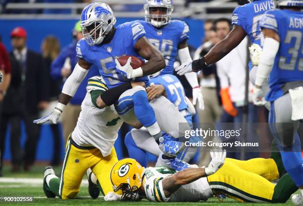 Tahir Whitehead of the Detroit Lions recovers a fumbler by quarterback Brett Hundley of the Green Bay Packers during the first half at Ford Field on...