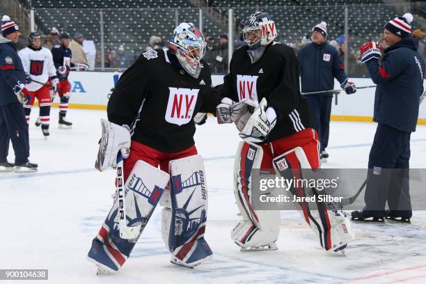 Ondrej Pavelec and Henrik Lundqvist of the New York Rangers on the ice during practice for the 2018 Bridgestone NHL Winter Classic at Citi Field on...