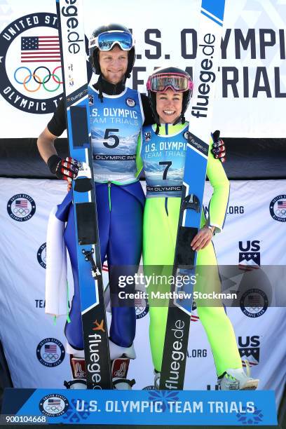 Michael Glasder and Sarah Hendrickson pose on the medals podium after the U.S. Men's and Womens Ski Jumping Olympic Trials on December 31, 2017 at...