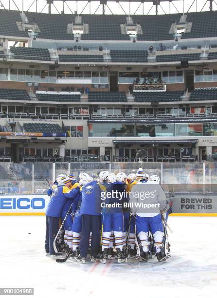 Buffalo Sabres players and coaches huddle during Practice Day for the 2018 Bridgestone NHL Winter Classic at Citi Field on December 31, 2017 in New...